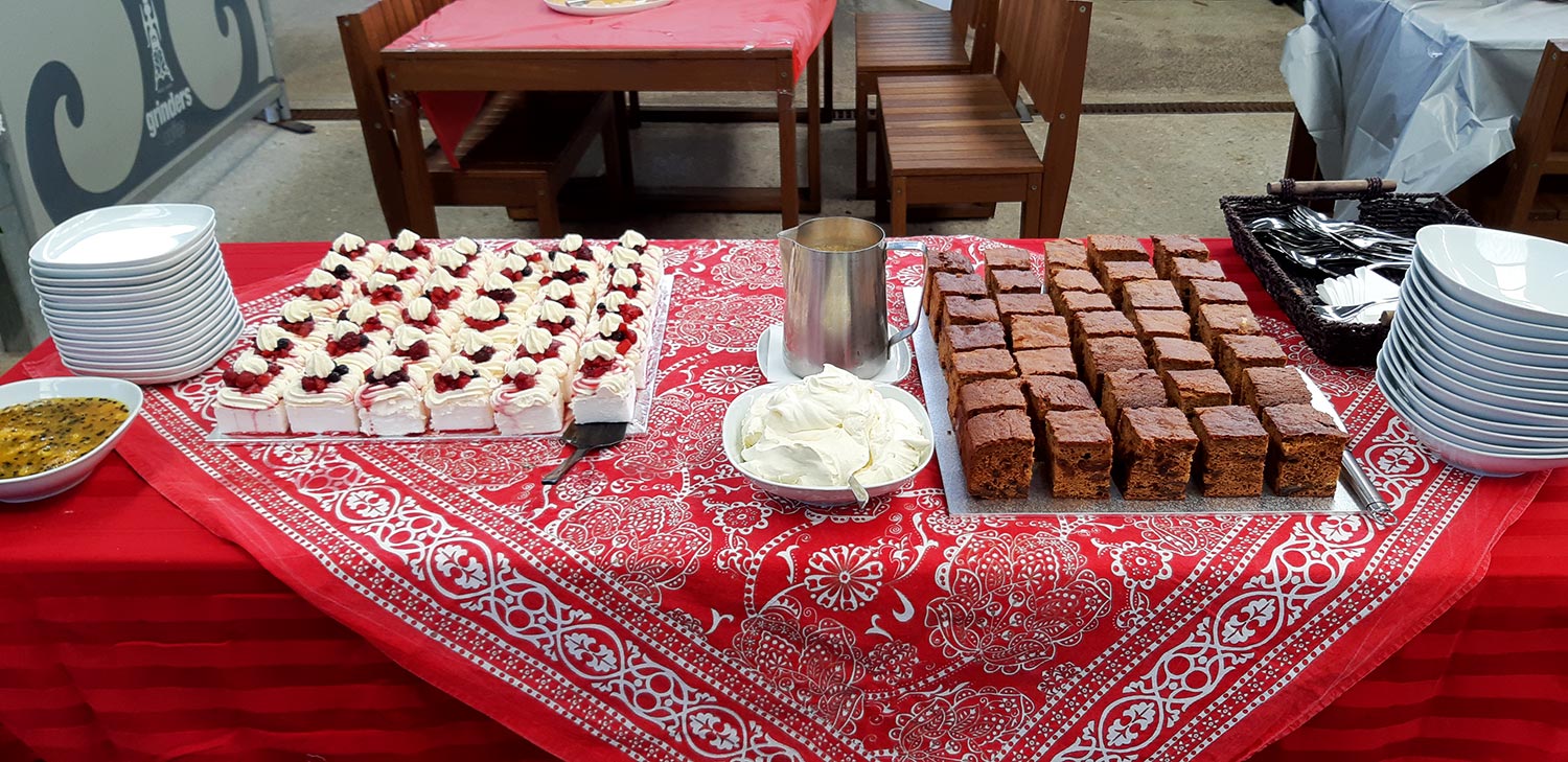 Dessert spread on table with brownies and cakes